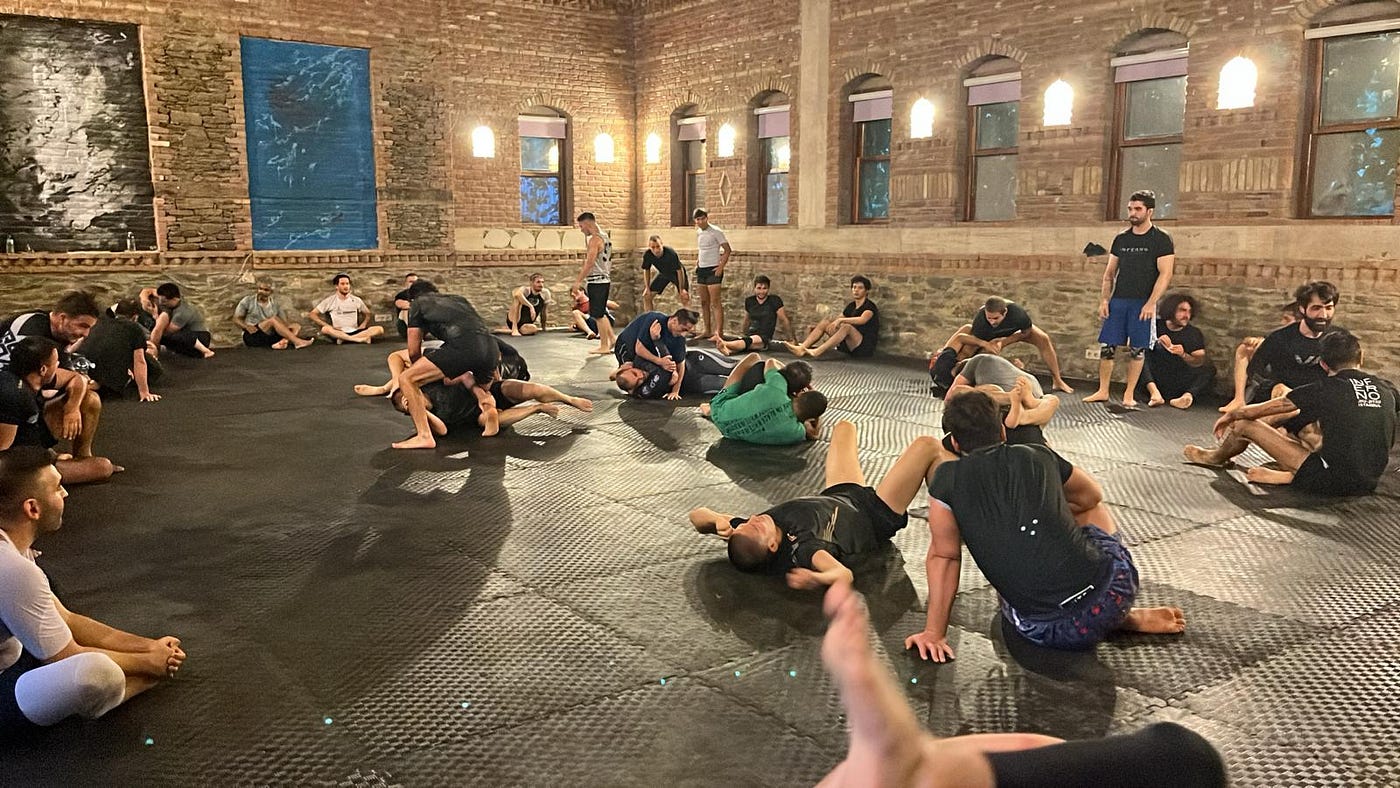 BJJ open mat session in a beautiful brick-walled academy
